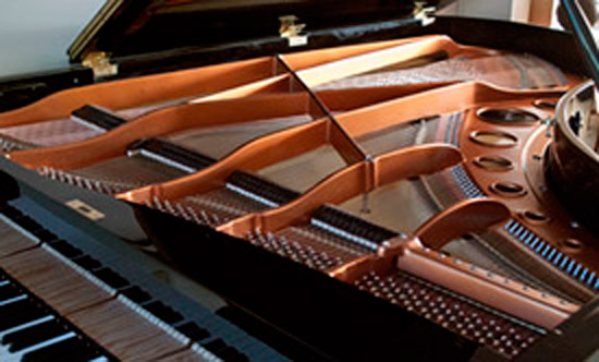 The finished interior of a restored grand piano